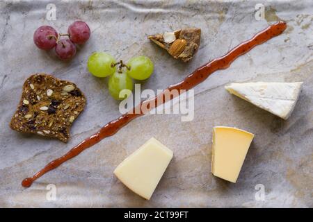 Cheese platter witch assorted cheese and grapes Stock Photo