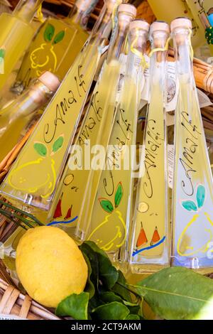 Bottles of limoncello liquor on sale in a souvenir shop of Amalfi, Campania, Italy Stock Photo