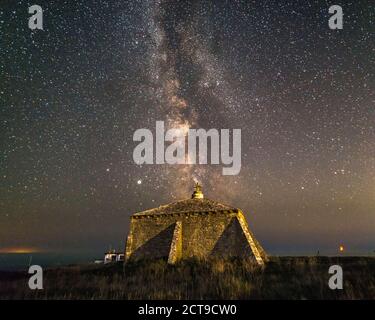 St Aldhelm’s Head, Worth Matravers, Dorset, UK.  21st September 2020.  UK Weather.  The Milky Way shines brightly in the clear night sky above St Aldhelm’s Chapel at St Aldhelm’s Head near Worth Matravers in Dorset.  Picture Credit: Graham Hunt/Alamy Live News Stock Photo