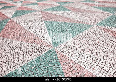 Mosaic tiles pavement background. Triangle paving. Toned photo Stock Photo