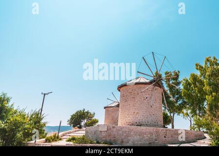 An old classic wind mill in a traditional, rural and beautiful town. . High quality photo Stock Photo