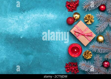 Blue Christmas frame border with spruce tree branches and holiday decorations. Festive template, mockup, copy space for text. New Year greeting card, Stock Photo