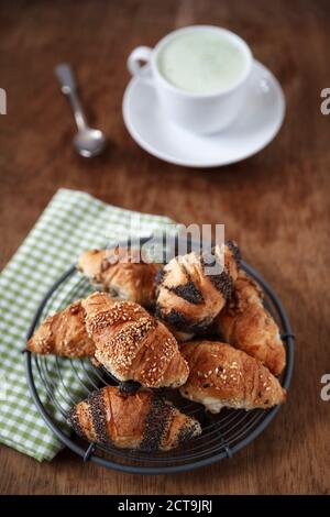 Mini croissants and cup of Matcha Latte Stock Photo