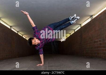 Young breakdancer in underpass Stock Photo