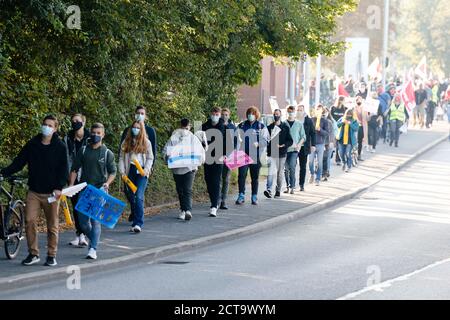 Kiel, Germany. 22 September 2020, Schleswig-Holstein, Kiel: Employees of Stadtwerke Kiel walk the streets during a demonstration of human chains. The warning strikes announced by the federal government and local authorities in several federal states began on Tuesday. With the warning strikes, the union wants to use the strikes to underline its wage demands in the ongoing wage dispute with the federal government and municipalities. Credit: dpa picture alliance/Alamy Live News Stock Photo