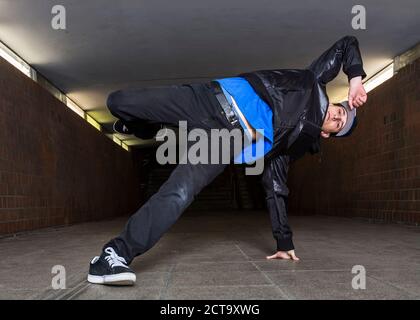 Young breakdancer in underpass Stock Photo