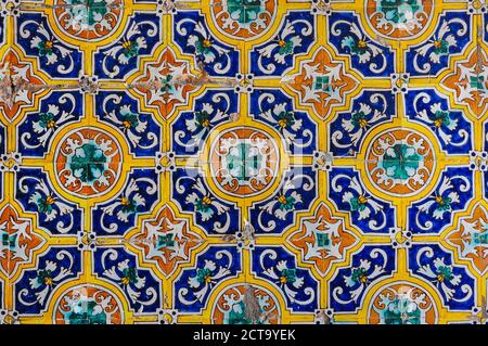 Ceramic tiles (azulejos) with floral patterns on a wall of the Alcazar of Seville, Spain Stock Photo