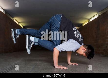 Young breakdancer in underpass Stock Photo