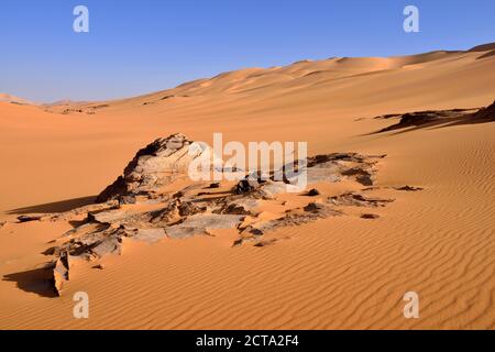 Africa, Algeria, Sahara, Tassili N'Ajjer National Park, Tadrart, Rocks and sand dunes at Oued In Djerane Stock Photo