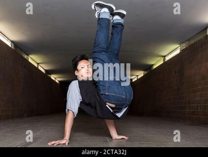 Young breakdancer in underpass Stock Photo