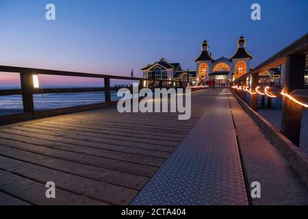 Germany, Mecklenburg-Western Pomerania, Rugia, view to sea bridge at Baltic seaside resort Sellin by twilight Stock Photo