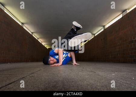 Young breakdancer in underpass Stock Photo