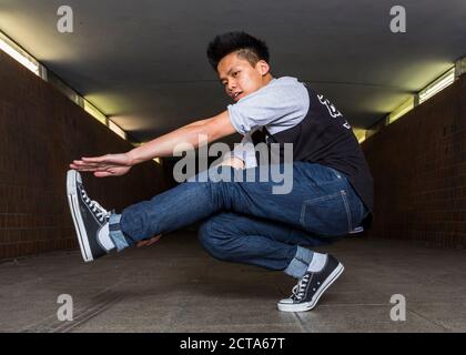 Young breakdancer in underpass Stock Photo