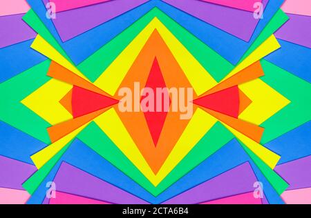 An abstract geometric textured background of multicolored rainbow colors created with overlapping foam craft paper Stock Photo