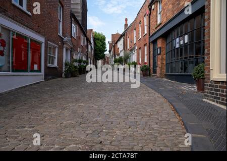 An old English cobbled street with traditional cottages in the center of Petworth West Sussex in England. Stock Photo