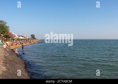 Busy Chalkwell Beach in Chalkwell, Southend on Sea, Essex, UK, on a warm September, Autumn sunny day, with blue sky and water. Visitors during COVID19