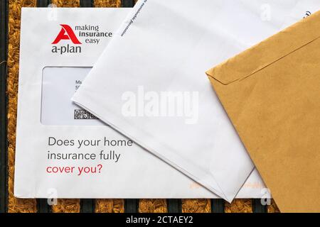 unsolicited mail junk mail on doormat - A-plan making insurance easy, does your home insurance fully cover you? Stock Photo