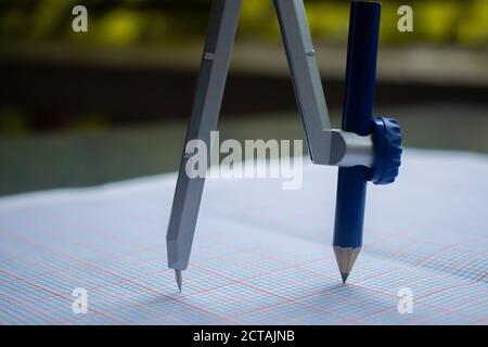 A Compass along with a Pencil Stock Photo