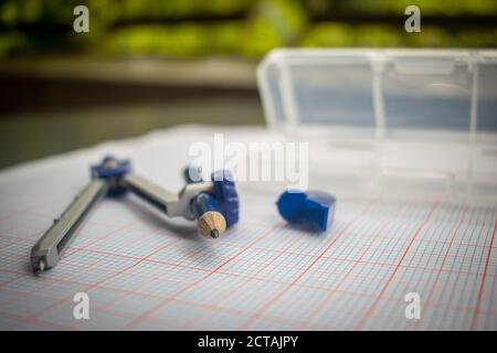 A Compass along with a Pencil Stock Photo