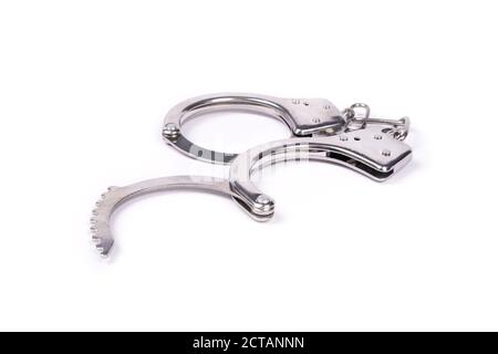 open handcuffs isolated on white background. Stock Photo