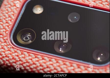 Clean camera lens module on modern smartphone close up view Stock Photo
