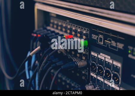 Audio jacks cable plugged into mixer console. XLR audio jacks cable Stock Photo