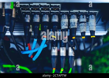 Audio jacks cable plugged into mixer console. XLR audio jacks cable Stock Photo