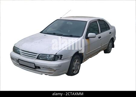 Old rusty white passenger car sedan with flat tires isolate on a white background. Stock Photo