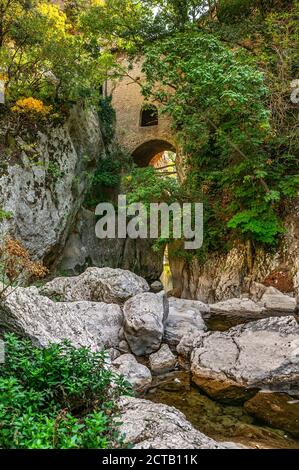 Raiano, Abruzzo region, Italy. Hermitage of San Venanzio suspended between rock walls on the dry Aterno river bed Stock Photo