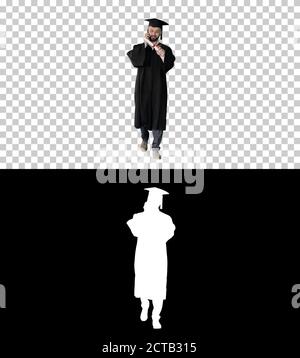 Graduating student walking and making a call, Alpha Channel with Stock Photo