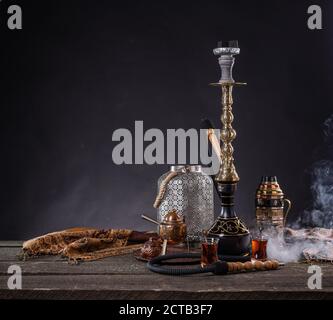 Arabic tea with shisha pipe in the bar close up Stock Photo - Alamy