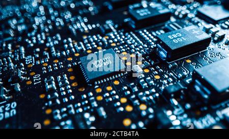 Macro Shot of Printed Circuit Board with Computer Motherboard Components: Microchip, CPU Processor, Transistors. Inside of Electronic Device, Parts of Stock Photo