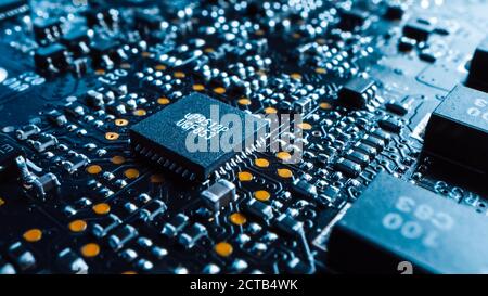 Close-up Macro Shot of Printed Circuit Board with Computer Motherboard Components: Microchip with Random Number on It, CPU Processor. Inside of Electr Stock Photo