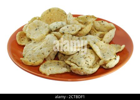 Fish crackers in plate isolated on white background Stock Photo