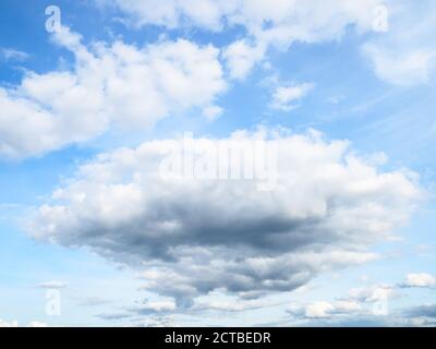 cumulus clouds in blue sky in September evening Stock Photo
