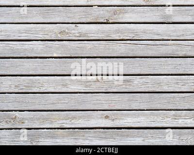 shabby gray wooden planks of outdoor pavement of pier Stock Photo