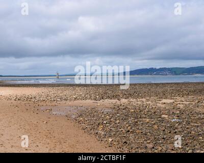 THe lighthouse and beach at Whiteford Sands beach on the River Lougfor estuary on the Gower Peninsula Wales UK Stock Photo