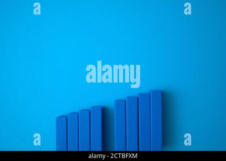 blue domino blocks of stairs with one empty in the middle. Stock Photo