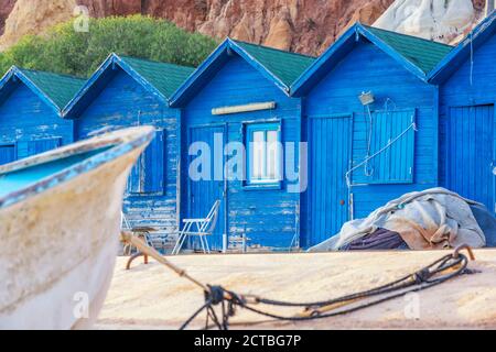 Blue fisherman's cabins on the beach in Olhos de Agua in the Algarve Stock Photo