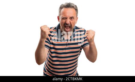 Adult man model making angry mad aggressive expression and gesture wearing summer casual stylish tshirt isolated on white studio background Stock Photo