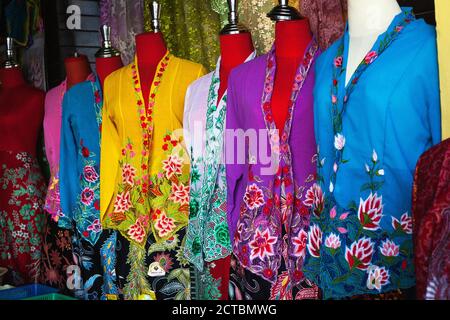 Multicolored womens blouses on headless mannequins selling at street market Stock Photo