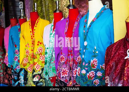 Multicolored womens blouses on headless mannequins selling at street market Stock Photo