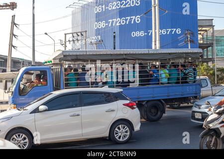 Phuket, Thailand - 26 February 2018: Bus with passengers and cars drive in traffic jam Stock Photo