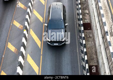 Phuket, Thailand - 26 February 2018: Ford Everest black car driving on road top view Stock Photo