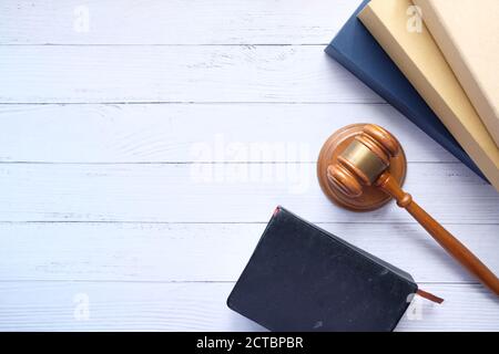 Top view of gavel and book with copy space on table  Stock Photo
