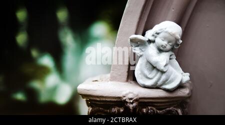 handmade plaster figure in garden park for background in vintage style Stock Photo