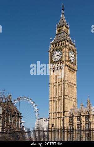 Elizabeth Tower, housing Big Ben, the Palace of Westminster, with the London Eye in the background, London, England. Stock Photo