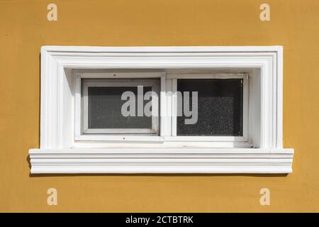 Window with a mosquito net in the wall Stock Photo