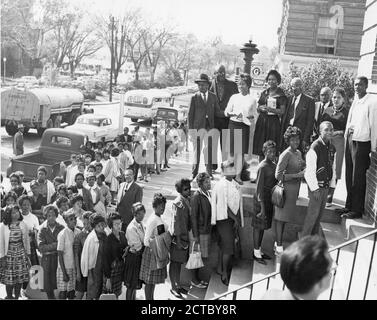 Residents in an African American neighborhood line up to register to vote, Macon, GA, 1962. (Photo by United States Information Agency/RBM Vintage Images) Stock Photo