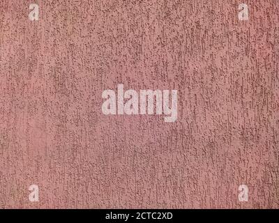 The texture of the pink plaster is bark beetle on the wall. Seamless grey texture. Stock Photo